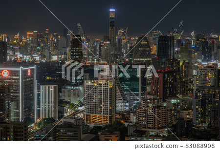 Bangkok downtown cityscape with skyscrapers at night give the city a modern style. Bangkok downtown cityscape with skyscrapers at night give the city a modern style. 83088908
