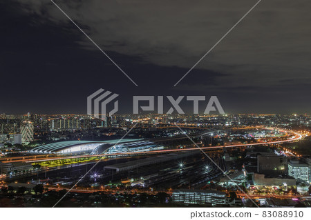Aerial view of Bang Sue central station with skyscrapers background at night. 83088910