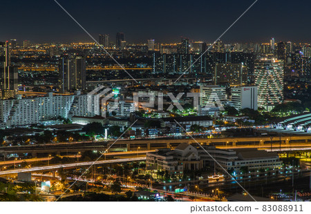 Aerial view of Bang Sue central station with skyscrapers background at night. Aerial view of Bang Sue central station with skyscrapers background at night. 83088911