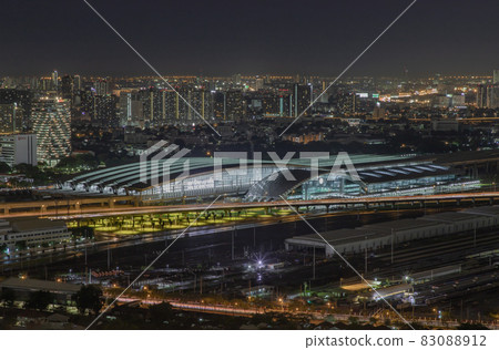 Aerial view of Bang Sue central station with skyscrapers background at night. Aerial view of Bang Sue central station with skyscrapers background at night. 83088912