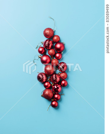Christmas decorations red New Year's balls on blue background. Mock up holiday Christmas card copy space 83089499
