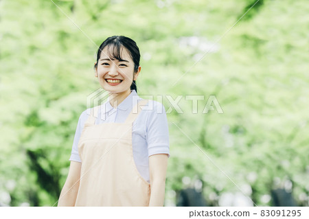 A woman with an apron A woman with an apron 83091295