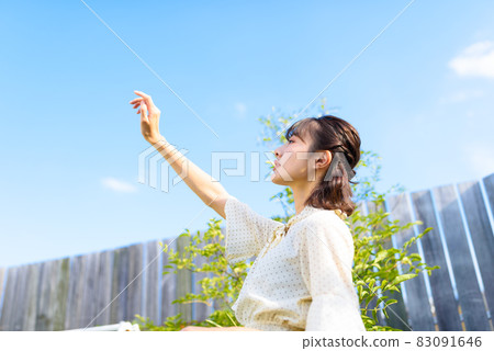 A woman in sunlight A woman in sunlight 83091646