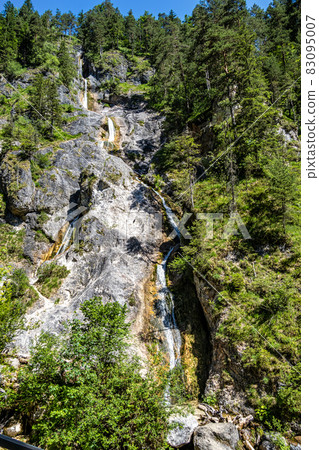 The wild-romantic Almbachklamm in the Berchtesgaden Land is a popular excursion destination in Bavaria, Germany 83095007
