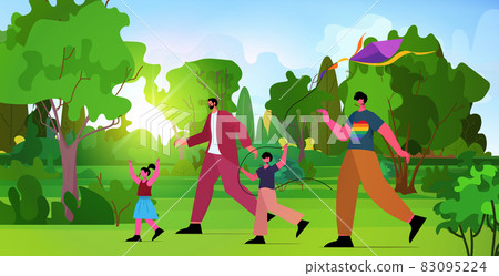 gays family launching kite with little children in park fatherhood transgender love LGBT community concept 83095224