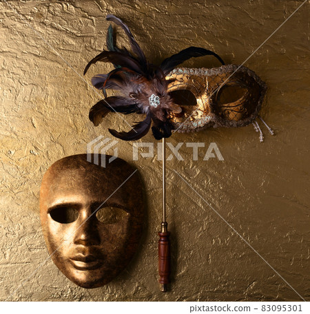 carnival masks on a golden background carnival masks on a golden background 83095301