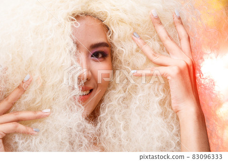 Half Body Portrait of 20s Asian Caucasian beautiful Woman blonde afro hair high fashion make up Half Body Portrait of 20s Asian Caucasian beautiful Woman blonde afro hair high fashion make up 83096333