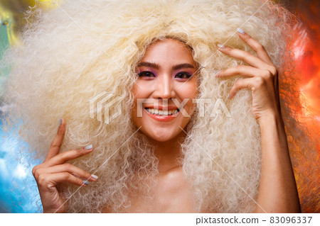 Half Body Portrait of 20s Asian Caucasian beautiful Woman blonde afro hair high fashion make up Half Body Portrait of 20s Asian Caucasian beautiful Woman blonde afro hair high fashion make up 83096337
