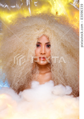 Half Body Portrait of 20s Asian Caucasian beautiful Woman blonde afro hair high fashion make up Half Body Portrait of 20s Asian Caucasian beautiful Woman blonde afro hair high fashion make up 83096339