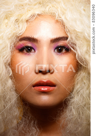 Half Body Portrait of 20s Asian Caucasian beautiful Woman blonde afro hair high fashion make up Half Body Portrait of 20s Asian Caucasian beautiful Woman blonde afro hair high fashion make up 83096340