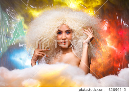 Half Body Portrait of 20s Asian Caucasian beautiful Woman blonde afro hair high fashion make up Half Body Portrait of 20s Asian Caucasian beautiful Woman blonde afro hair high fashion make up 83096343