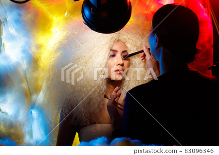 Behind the scene of make up artist of Half Body Portrait of 20s Asian beautiful Woman blonde afro Behind the scene of make up artist of Half Body Portrait of 20s Asian beautiful Woman blonde afro 83096346
