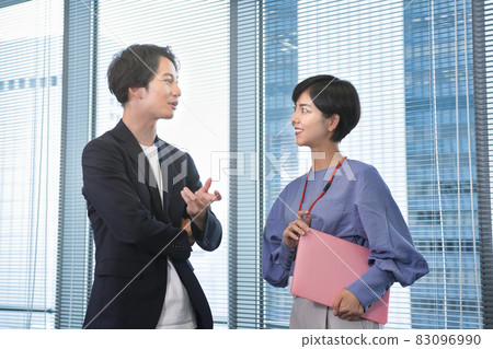 Business person talking in the office Business person talking in the office 83096990