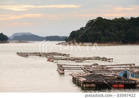 Kujukushima and aquaculture raft at sunset 83097422