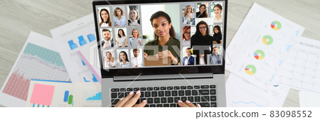 Woman sitting on floor near documents and communicating via video link with team of employees top view 83098552