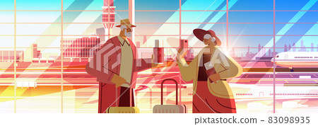 senior couple of tourists using smartphones grandparents with luggage passports and tickets ready to boarding 83098935