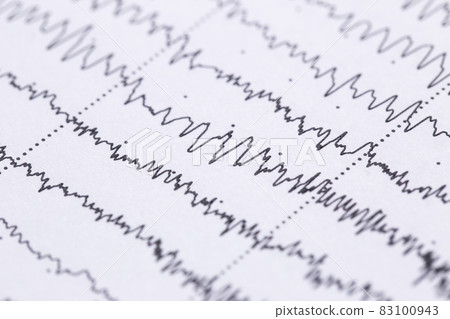 Cardiogram on a sheet of paper close-up. Texture of pulsed waves 83100943
