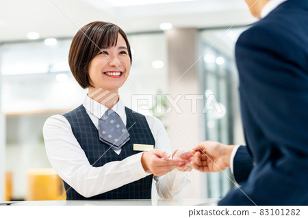 Young female staff checking in at the hotel Photo cooperation: WEEK Shibadaimon (Sun Frontier Fudousan) 83101282