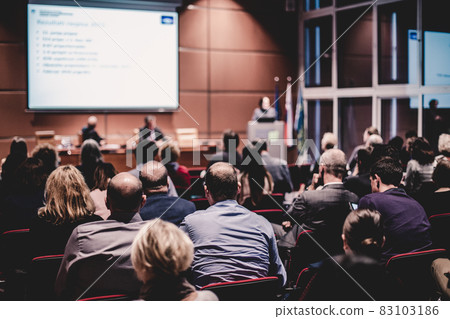 Audience in lecture hall participating at business event. 83103186