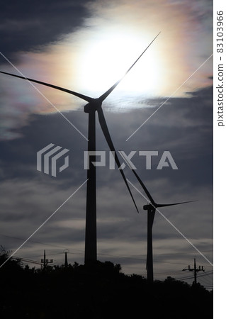 Windmill nestled at dusk 83103966