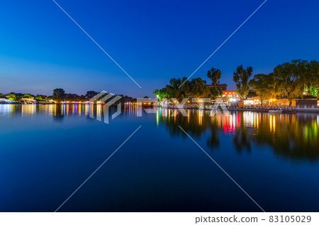 Peaceful reflection of the evening blue hour in Shichahai lake in Beijing Peaceful reflection of the evening blue hour in Shichahai lake in Beijing 83105029