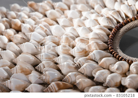 Handmade necklace made of white shells, closeup Handmade necklace made of white shells, closeup 83105218