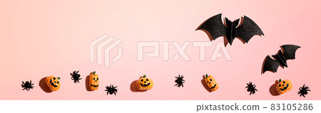 Halloween paper bats and small pumpkin ghosts 83105286