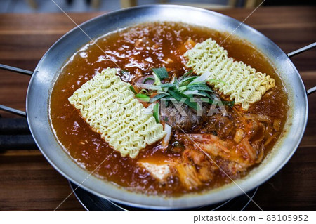 Budaejjigae hotpot stewed with ham, sausage, tofu and vegetables, traditional Korean food 83105952