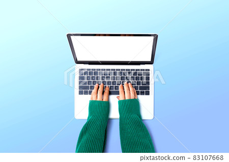 Person using a laptop computer Person using a laptop computer 83107668