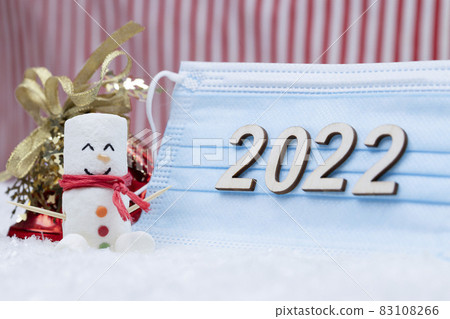 New Year and Merry Christmas 2022. Snowman from marshmallows. New Year theme. New Year and Merry Christmas 2022. Snowman from marshmallows. New Year theme. 83108266