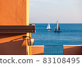 two sailboats in mediterranean sea 83108495