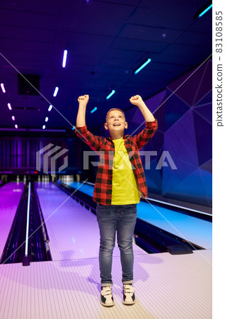 Boy playing bowling, happy little bowler 83108585