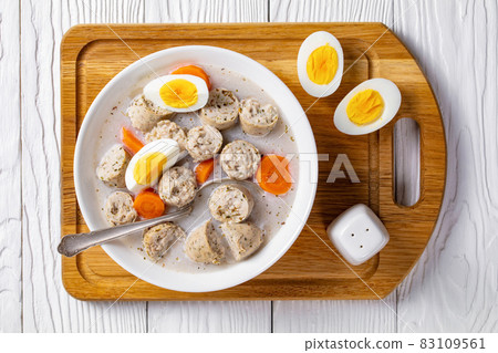 Zurek polish rye soup on a white wooden background Zurek polish rye soup on a white wooden background 83109561