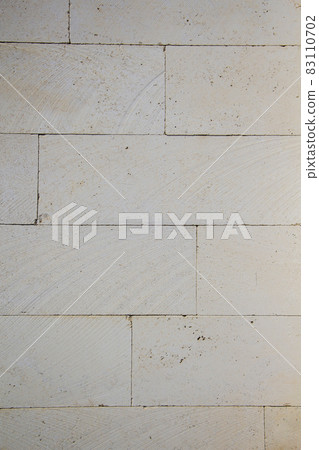 sandstone brick wall, background, close-up. Eco-friendly construction. sandstone brick wall, background, close-up. Eco-friendly construction. 83110702