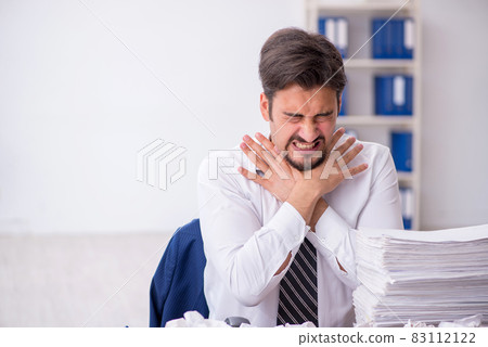 Young male employee in brainstorming concept 83112122