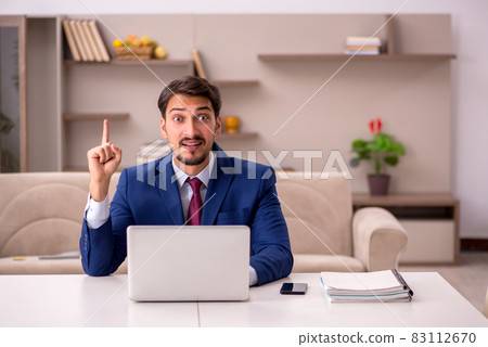 Young businessman working from house Young businessman working from house 83112670