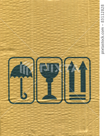 Brown and beige corrugated cardboard and warning signs detail Brown and beige corrugated cardboard and warning signs detail 83112828