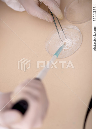 Young male chemist in drugs synthesis concept 83113284