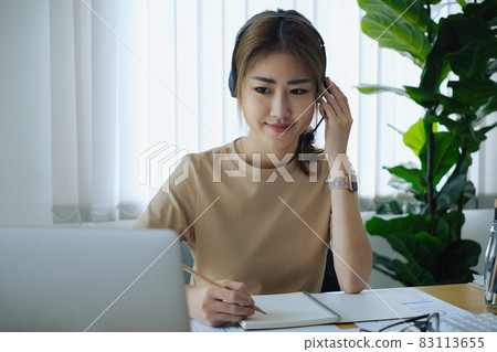 Businesswoman in having a video call on laptop while discussion with business partner during work from home. Support concept Businesswoman in having a video call on laptop while discussion with business partner during work from home. Support concept 83113655