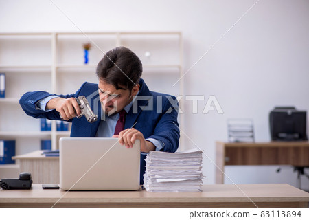 Young businessman employee and too much work in the office Young businessman employee and too much work in the office 83113894