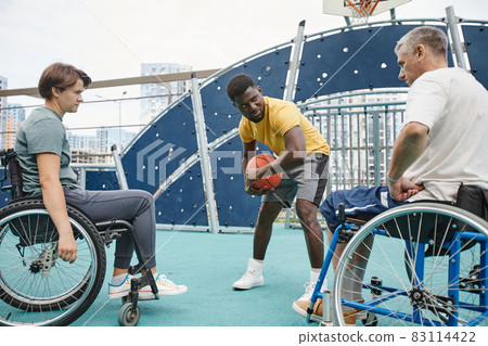 People with disability learning to play basketball People with disability learning to play basketball 83114422