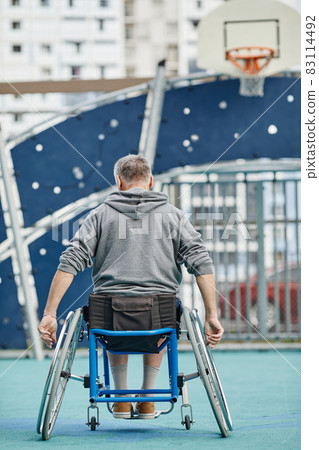 Man with disability on sport ground Man with disability on sport ground 83114492