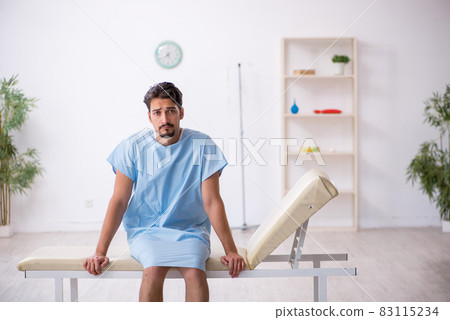 Young male patient waiting for doctor at the hospital 83115234