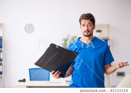 Young male doctor radiologist working in the clinic Young male doctor radiologist working in the clinic 83115319