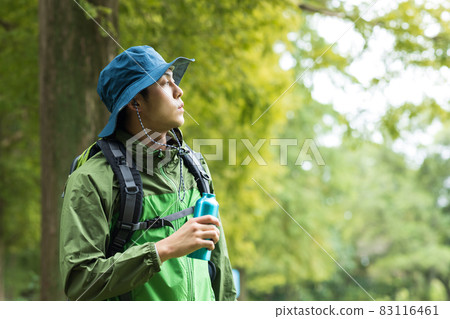 Young man enjoying a hike Young man enjoying a hike 83116461