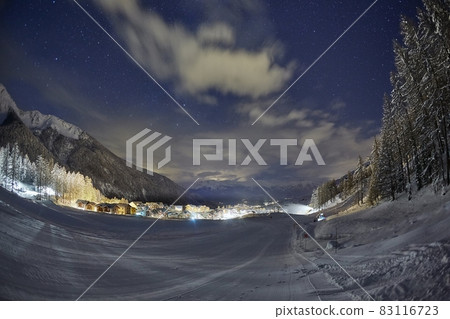 Ski slopes at night under the stars in the sky 83116723