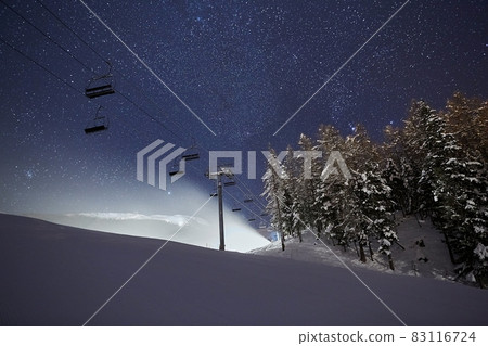 Ski lift at night under the stars in the sky Ski lift at night under the stars in the sky 83116724