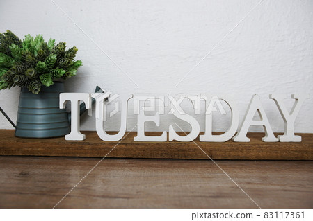 Tuesday alphabet letters on wooden background Tuesday alphabet letters on wooden background 83117361