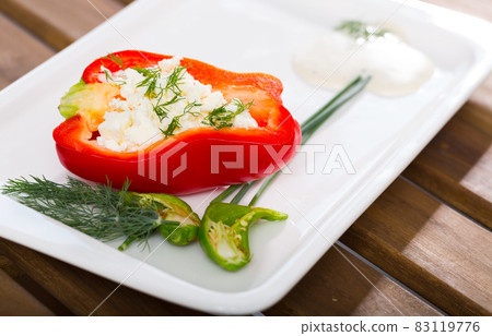 Pepper stuffed with brynza is tasty dish of Bulgarian cuisine 83119776