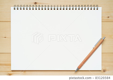Sketchbook and mechanical pencil placed on a wooden board 83120384